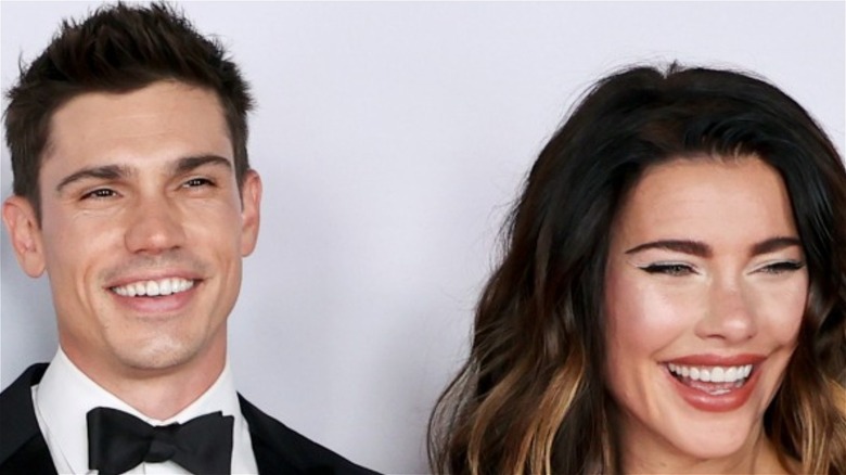 Tanner Novlan and Jacqueline MacInnes Wood posing on the red carpet