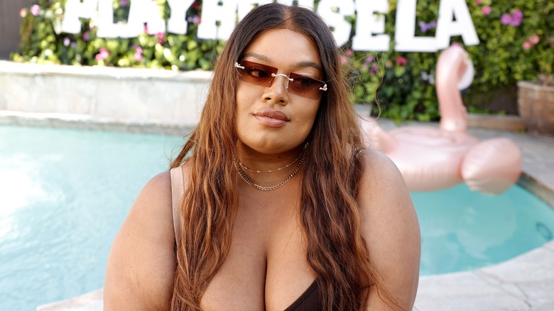 Stella Williams sitting by the pool