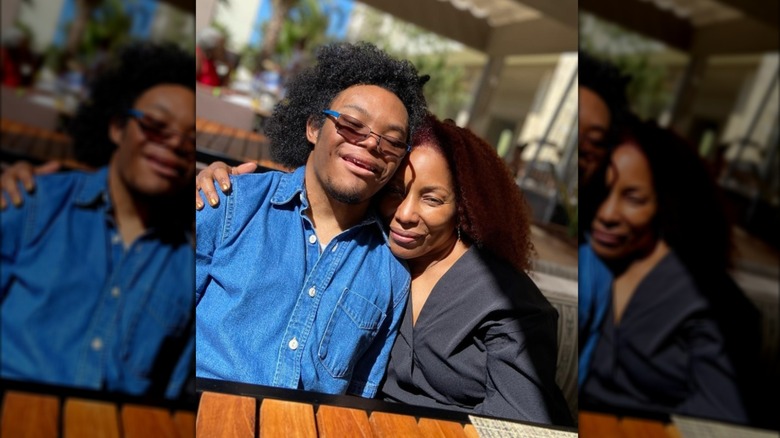 Stephanie Mills smiles for a picture with her son, Farad.