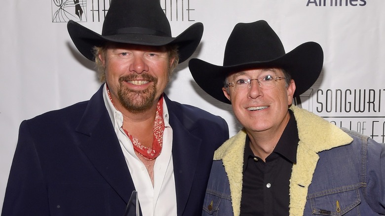 Toby Keith Stephen Colbert smiling cowboy hats