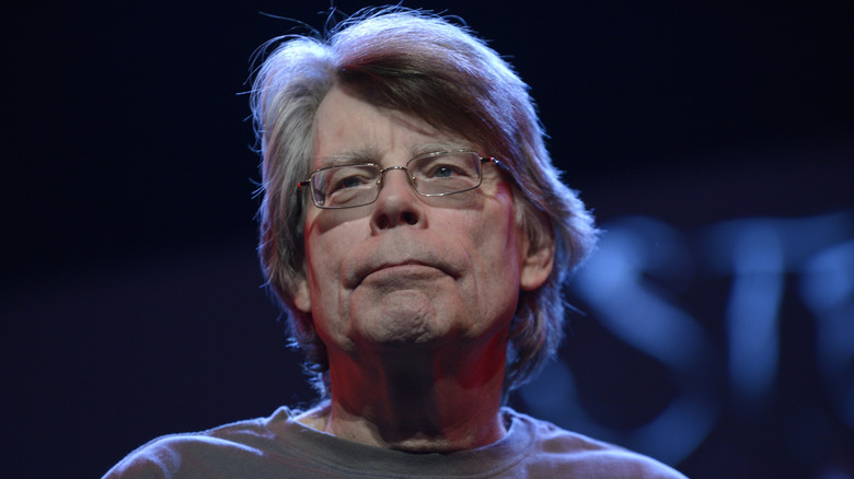 Stephen King looking serious in glasses