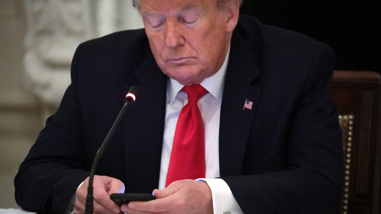Donald Trump scrolling on his phone