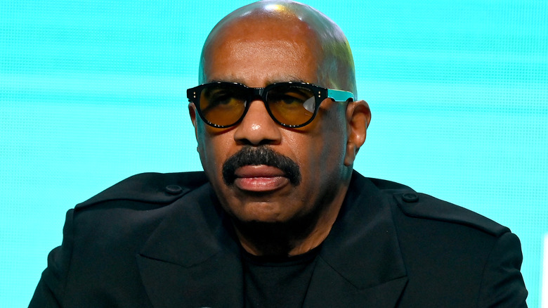 Steve Harvey looking off to the side