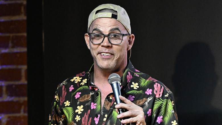 Steve-O holding a microphone