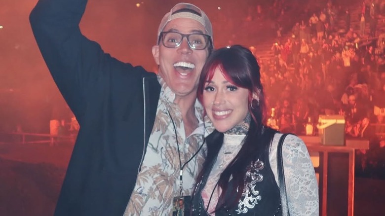 Steve-O and Koral Bickel smiling in front of a crowd