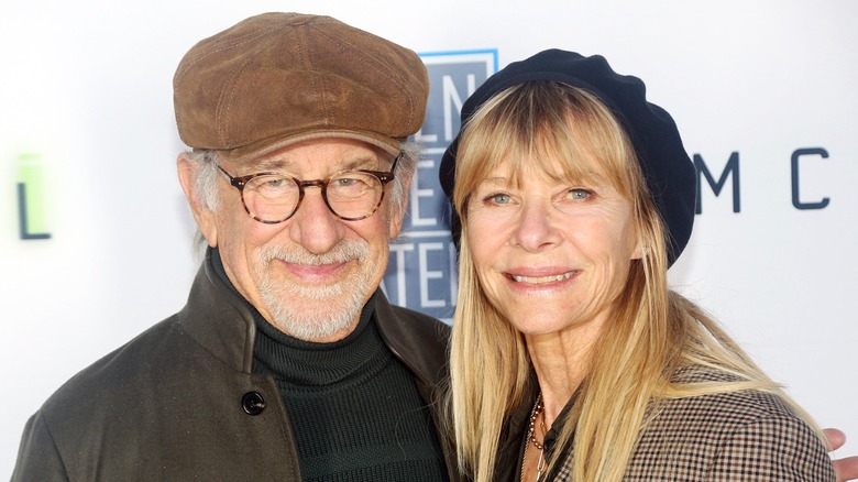 Steven Spielberg and Kate Capshaw smiling in hats