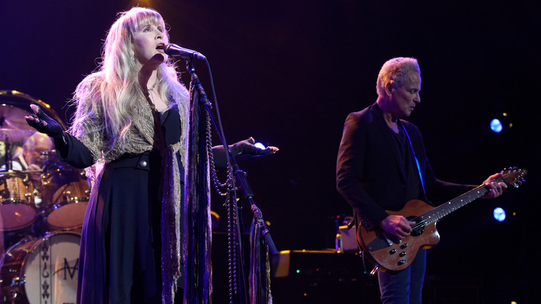 Stevie Nicks singing beside Lindsey Buckingham