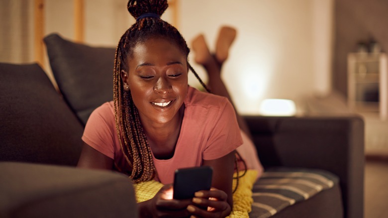 Woman relaxing on her phone