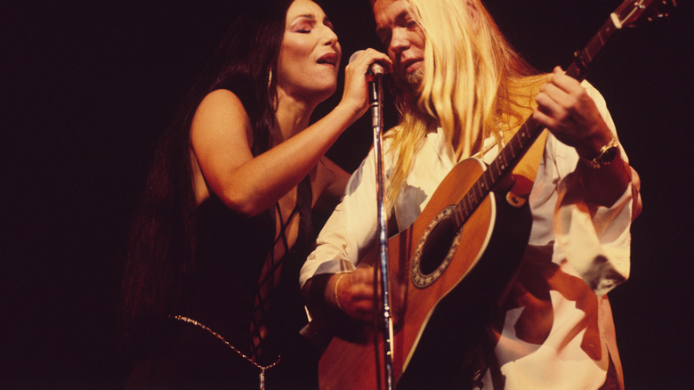 Cher performing onstage with Gregg Allman