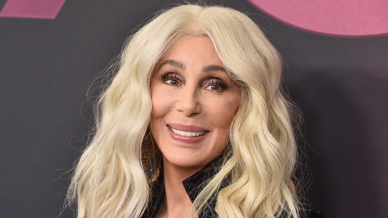 Cher smiling with bleached golden hair