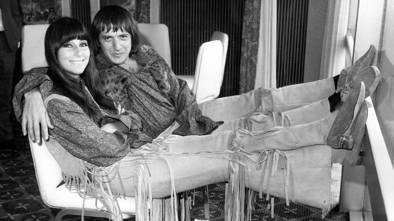 Cher and Sonny Bono smiling in fringed pants