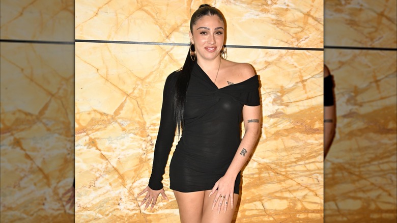 Lourdes Leon smiling at the Saint Laurent womenswear show