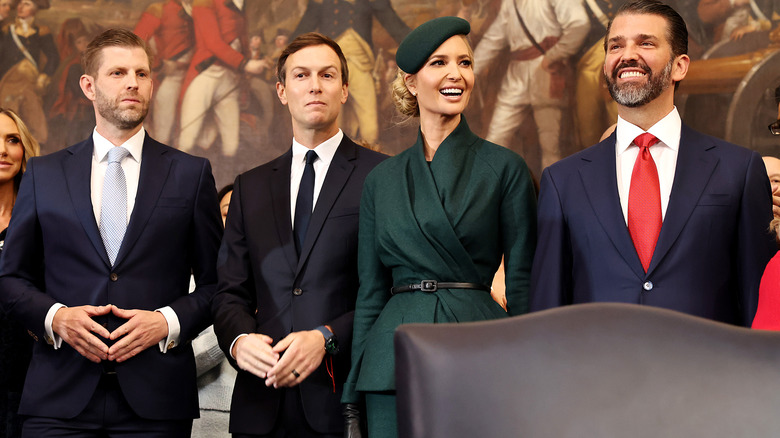 Eric Trump making an infamous hand gesture at the 2025 Inauguration ceremony