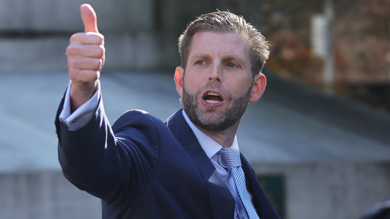 Eric Trump showing people a thumbs-up