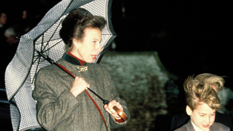 Princess Anne holding umbrella, 1990