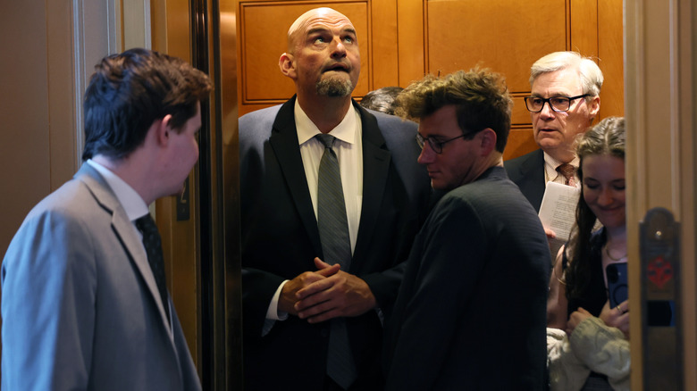 John Fetterman in a packed elevator.