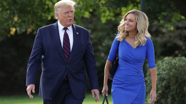 Kayleigh McEnany smiling at Donald Trump as they walk together