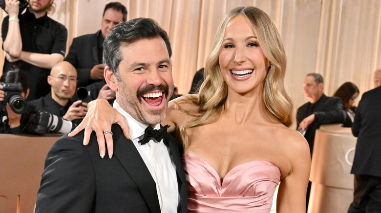 Chris Convy and Nikki Glaser posing for a photo