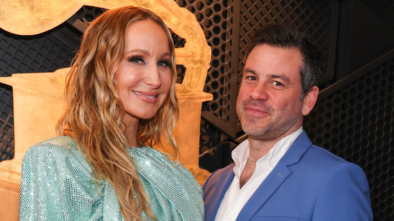 Nikki Glaser smiling in a photo with Chris Convy