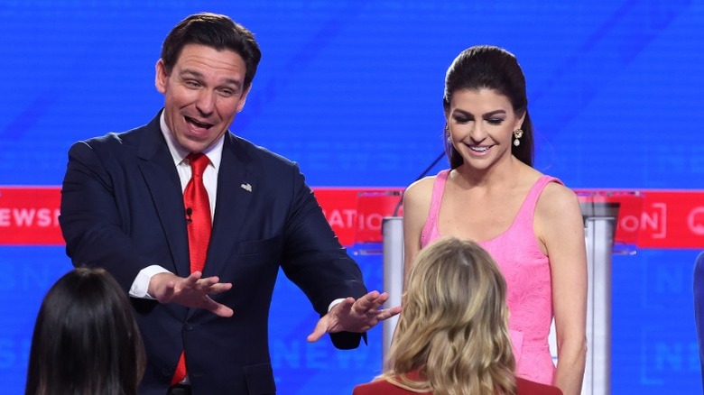 Ron DeSantis and Casey DeSantis onstage at the NewsNation Republican Presidential Primary Debate in Tuscaloosa, AL (2023)