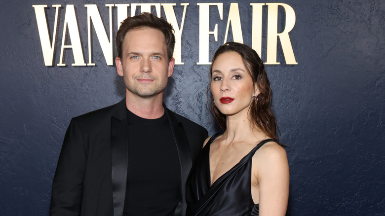 Patrick J. Adams posing with his arm around Troian Bellisario at Patrick J. Adams and Troian Bellisario at Chateau Marmont's Bar Marmont