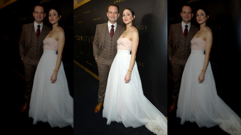Troian Bellisario wearing the bottom half of her wedding dress and posing with Patrick J. Adams at the 2020 Golden Globes