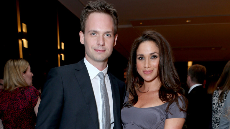 Patrick J. Adams and Meghan Markle posing at the FINCA Canada Fundraiser
