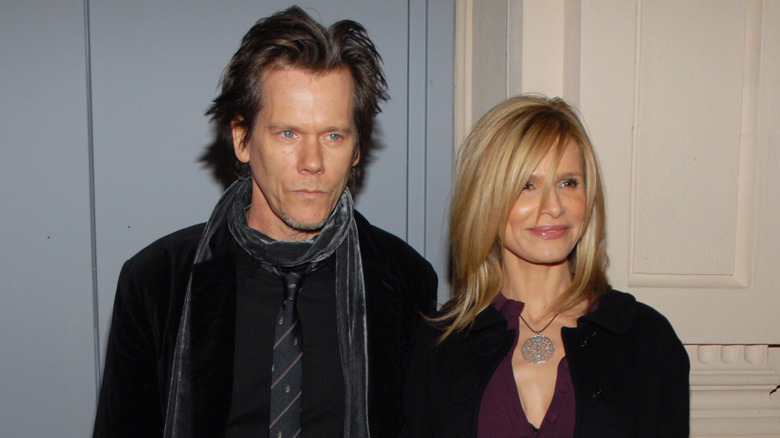 Kevin Bacon with Kyra Sedgwick posing together at an event