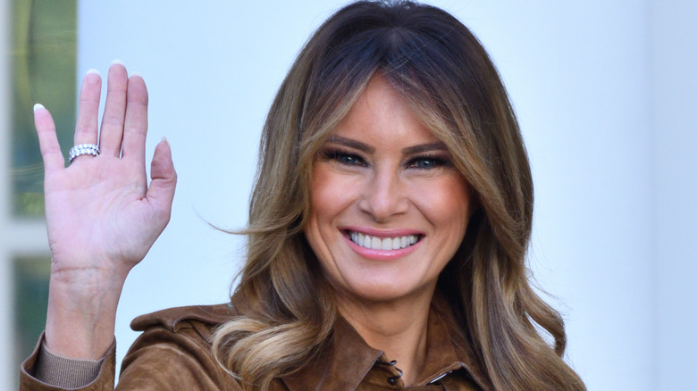 Melania Trump smiling and waving