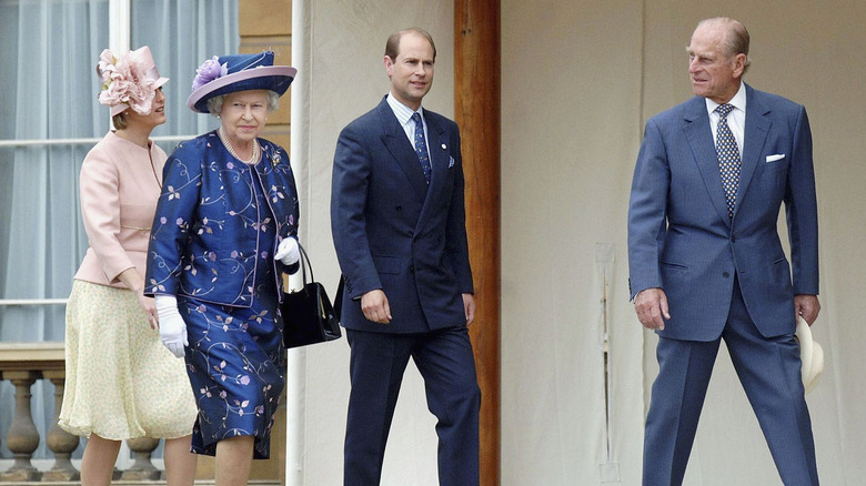 Sophie, Duchess of Edinburgh, Prince Edward, Queen Elizabeth, and Prince Philip walking outside
