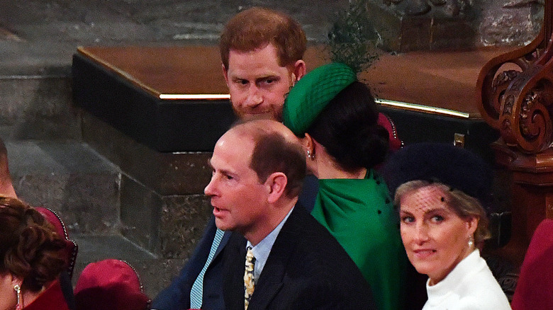 Prince Harry and Meghan Markle sit by Duke and Duchess of Edinburgh