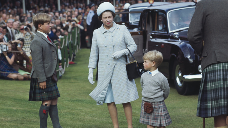 The Queen with a young Prince Andrew and Prince Edward at public event