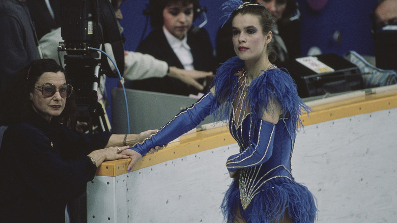 Katarina Witt pausing between rounds of skating at the 1988 Olympics