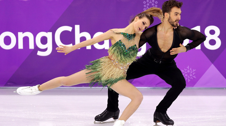 Gabriella Papadakis and Guillaume Cizeron skating with her partner at 2018 Olympics