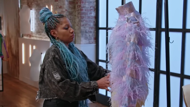 Kara Saun putting the final touches to a feathery piece during "Project Runway" season 20