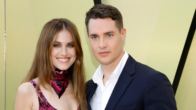 Alexander Dreymon and Allison Williams posing at an event