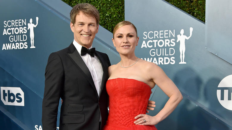 Stephen Moyer and Anna Paquin posing at an event