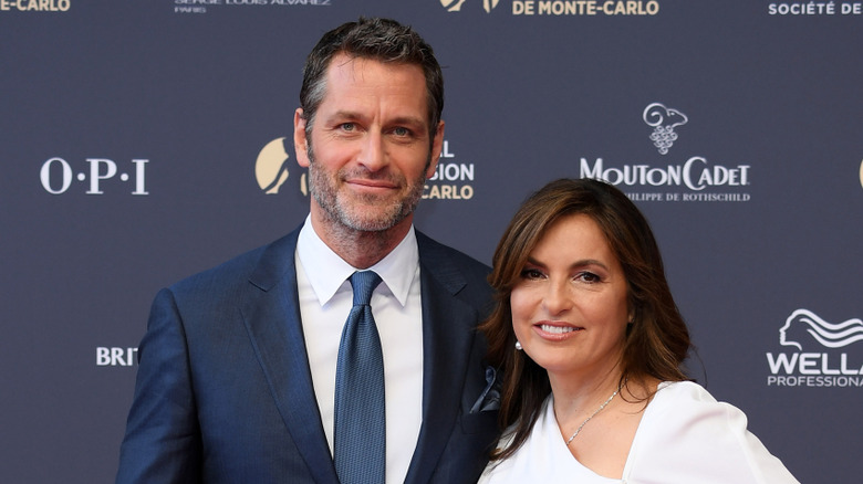 Peter Hermann and Mariska Hargitay posing at an event