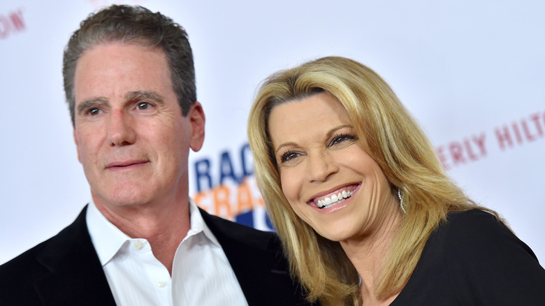 Vanna White standing next to John Donaldson