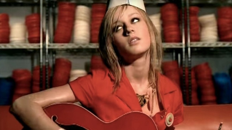 Brie Larson playing guitar in the stockroom of a fast food joint