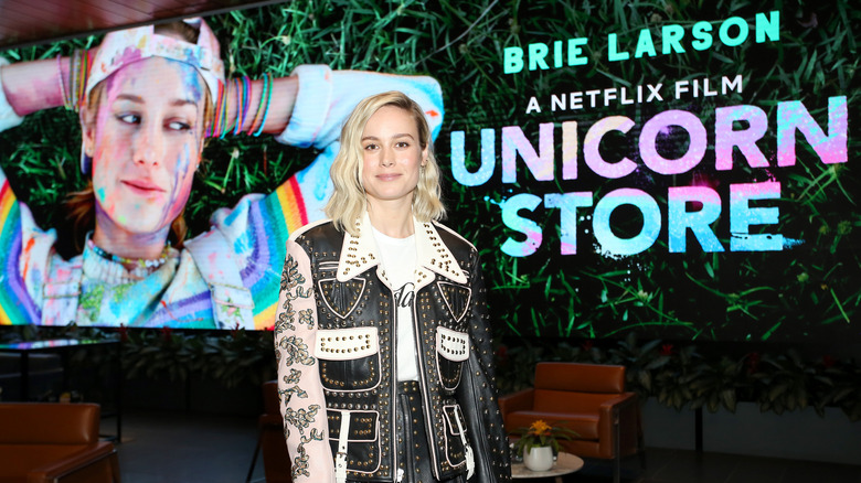 Brie Larson poses in front of her directing project, "Unicorn Store"