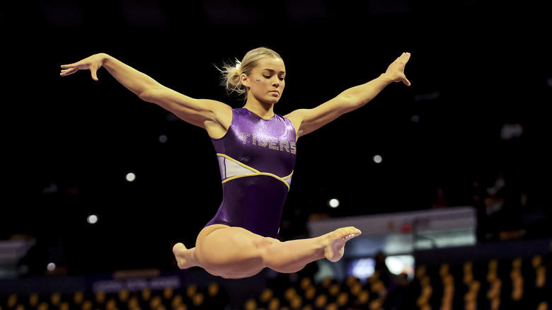 Olivia Dunne in a gymnastics jump in January 2025