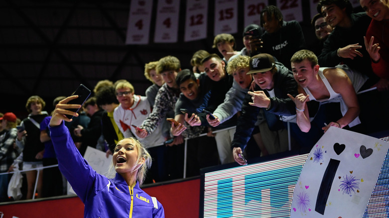 Olivia Dunne taking selfies with fans