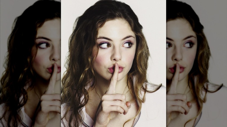 Tamsin Egerton looking off to the side