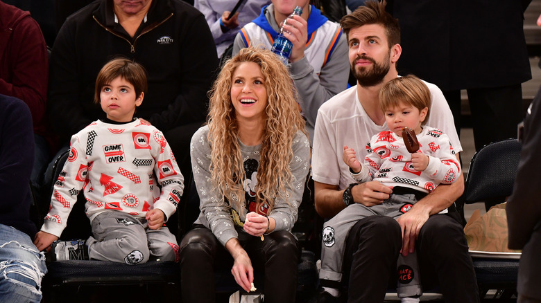 Shakira and Gerard Piqué with their sons at a basketball game