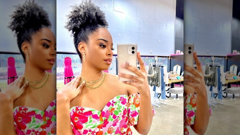Woman taking selfie in strapless flower dress