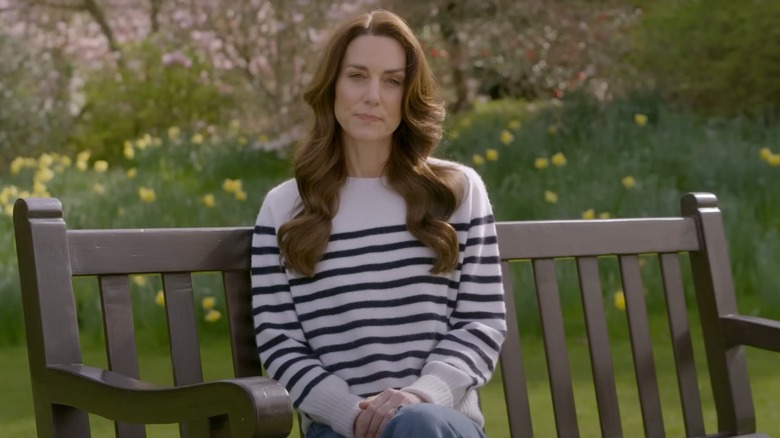 Kate Middleton sitting on a bench