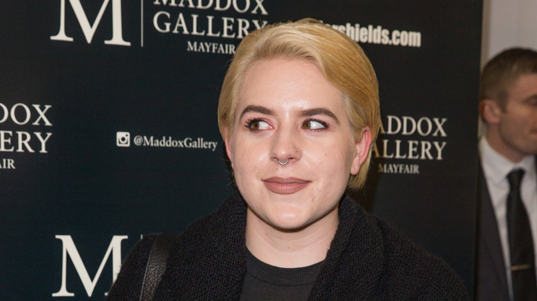 Bella Cruise smirking