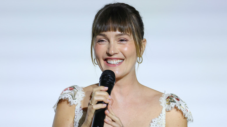 Leighton Meester smiling and speaking at an event in 2026.