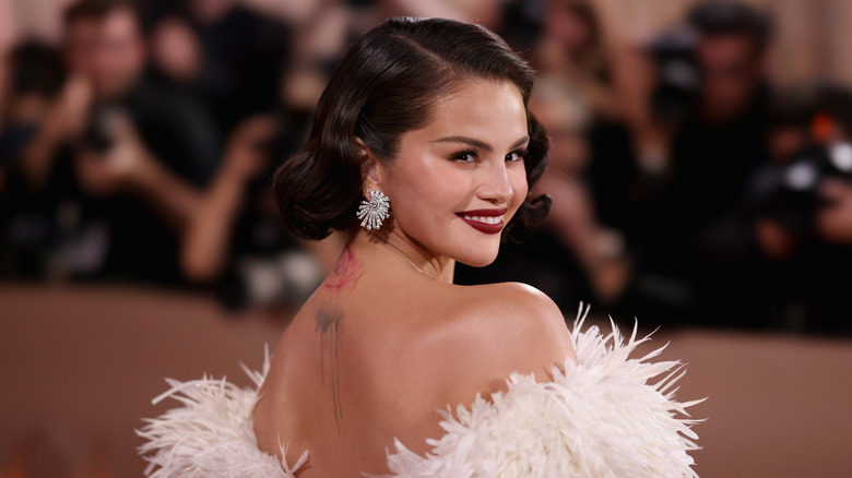 Selena Gomez posing smiling at the 2026 Golden Globe Awards.